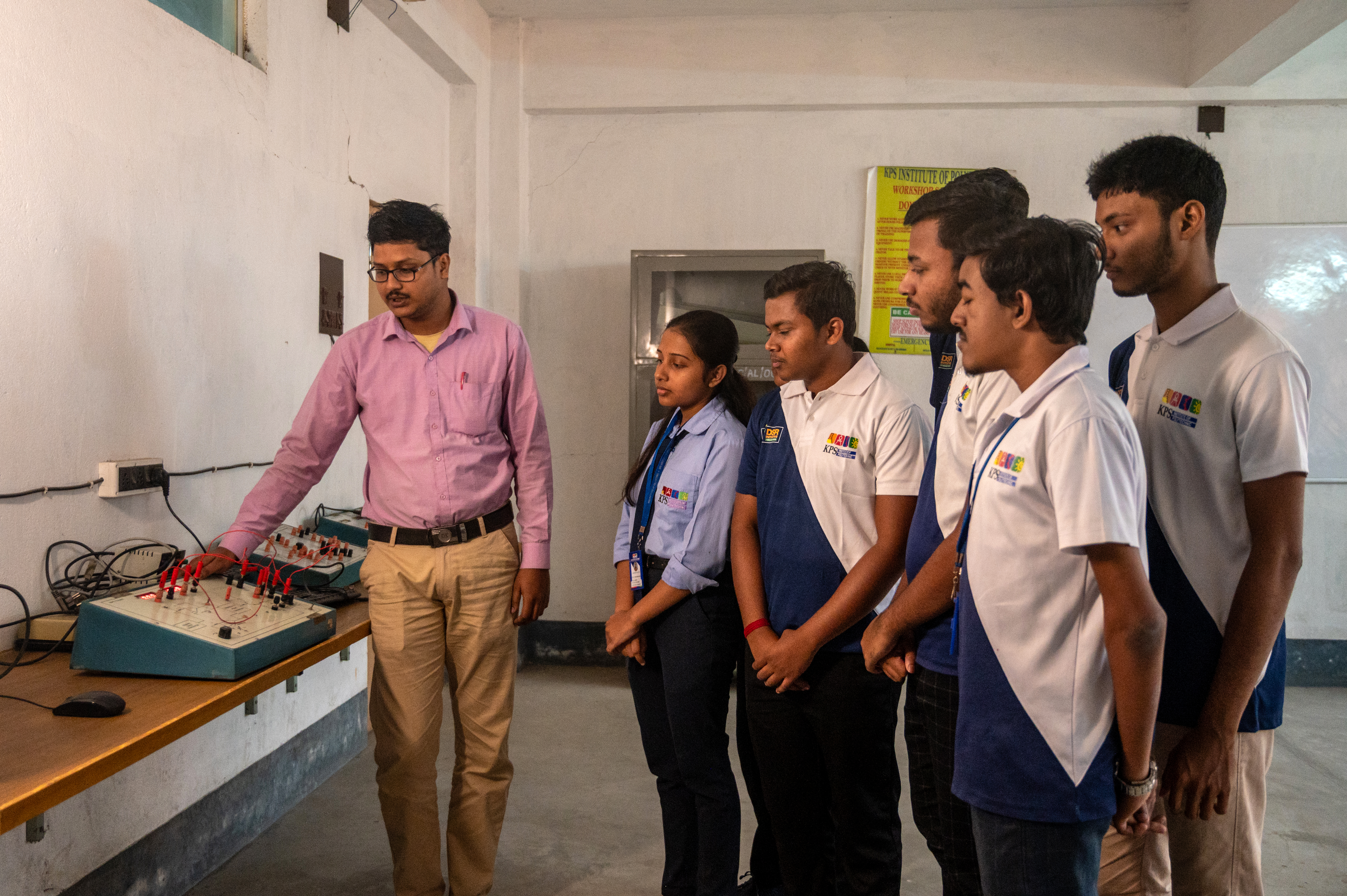 Students using electronics laboratory instruments